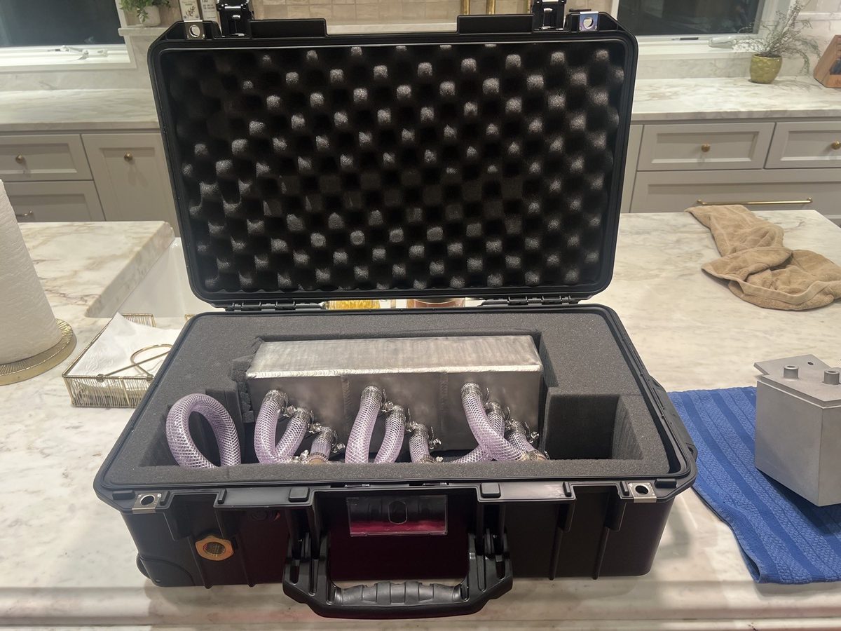 CAST bench-test kit in a protective case with tubing — used for client influent testing